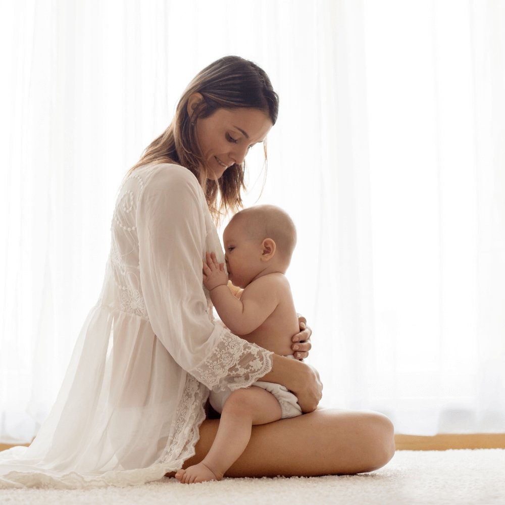 La posizione allattamento per neonato con reflusso - Dilamababy